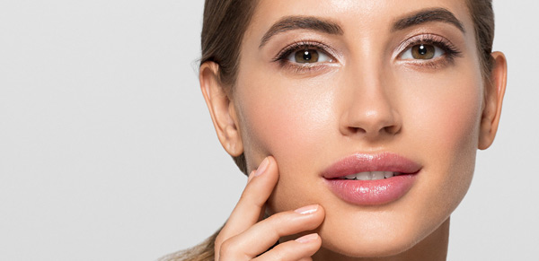 Woman with clear skin looking at camera